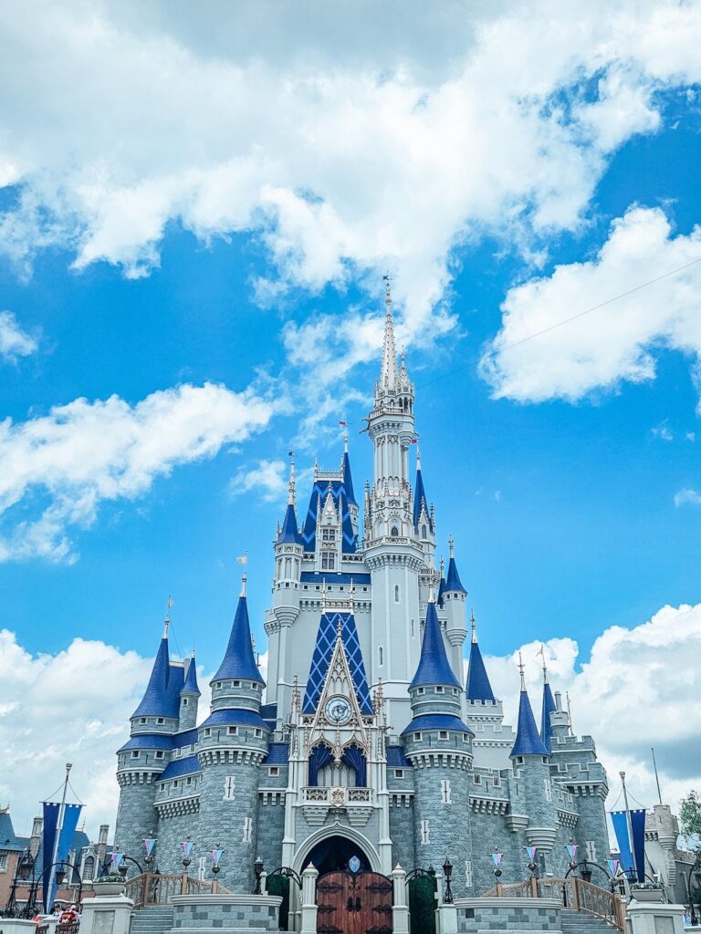 How to plan your first Disney World trip: Cinderella Castle at Magic Kingdom under a bright blue sky